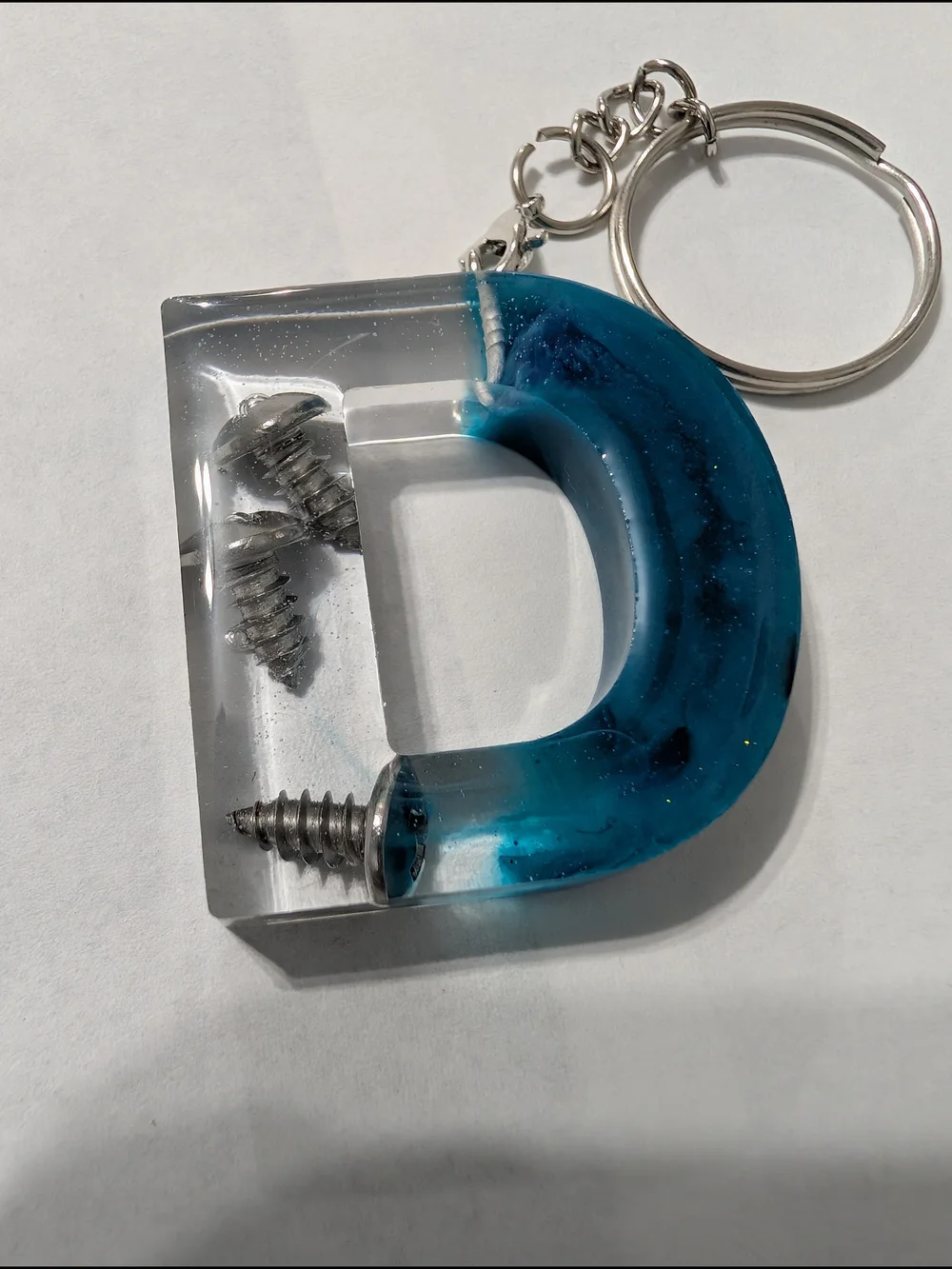 Blue Resin D-Shaped Keychain with Embedded Screws. Handmade